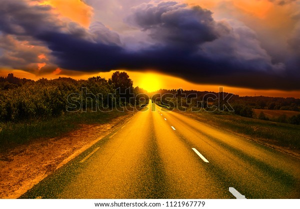 Beautiful sunny road in the morning. Driving on an\
empty road at lovely sunny day. Sun rising over asphalt country\
open road in sunny morning or evening. Open road at sunny sunset or\
sunrise time