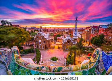 Beautiful sunrise in Barcelona seen from Park Guell. Park was built from 1900 to 1914 and was officially opened as a public park in 1926. In 1984, UNESCO declared the park a World Heritage Site