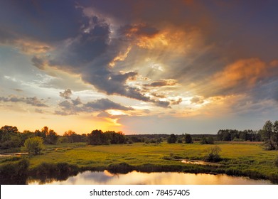 Beautiful sunrise and dramatic clouds on the sky. Flood waters of Narew river, Poland. - Powered by Shutterstock