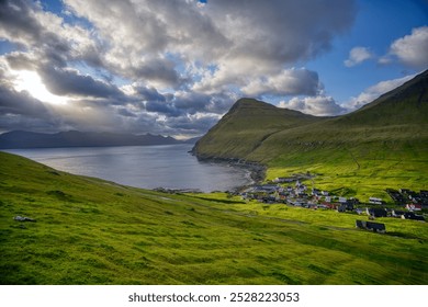 Beautiful sunrise light falling on the town of Gjógv. - Powered by Shutterstock