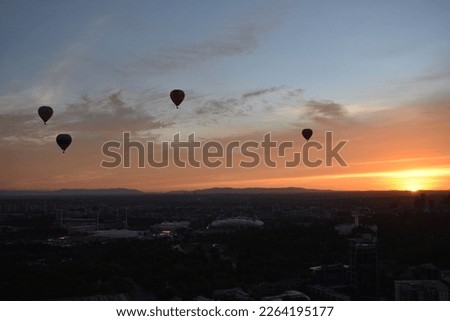 A beautiful sunrise in Melbourne, hot air balloons in Melbourne, Sunlight through clouds, Dawn, 
a great Daybreak, nice Morning, Sunup, First light, Cockcrow, Aurora, Breaking of the day, Crack of daw