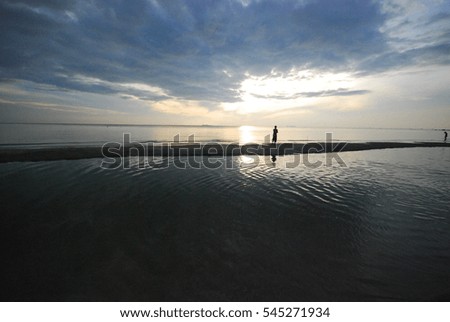 Similar – zwei personen bei sonnenuntergang im watt.