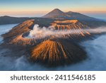 Beautiful sunrise at Mount Bromo volcano above sea of fog, the magnificent view of Mt. Bromo located in Bromo Tengger Semeru National Park, East Java, Indonesia.