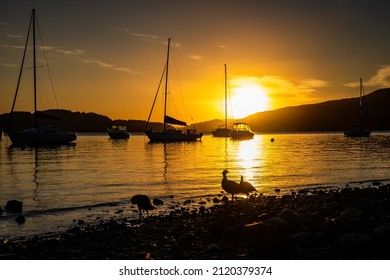 Beautiful Sunrise On Lake Nahuel Huapi With Boats