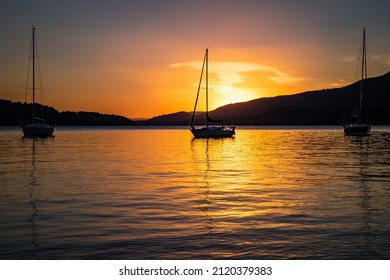 Beautiful Sunrise On Lake Nahuel Huapi With Boats