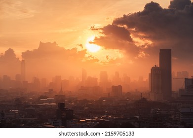 Beautiful sunrise over high rise building in business district at Bangkok city, Thailand