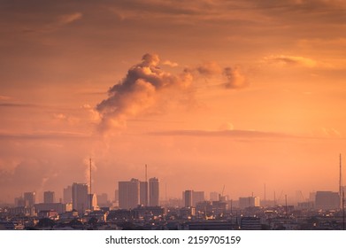 Beautiful sunrise over high rise building in business district at Bangkok city, Thailand