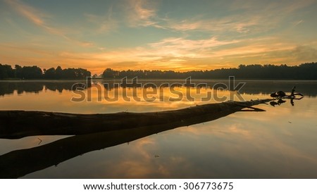 Similar – schöner Sonnenaufgang über dem See mit Pier und Yachten