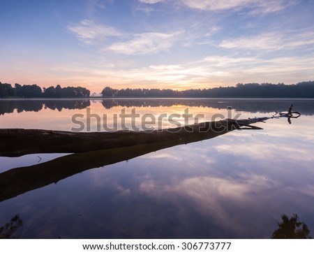 Similar – schöner Sonnenaufgang über dem See mit Pier und Yachten