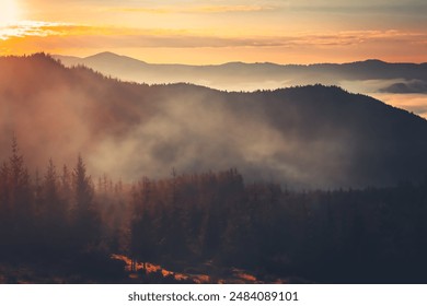 A beautiful sunrise over a misty mountain range. The sun is shining brightly, casting a warm glow on the landscape. The fog is slowly dissipating, revealing the peaks of the mountains in the distance - Powered by Shutterstock