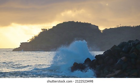 Beautiful Sunrise Over North Haven With Golden Haze And Waves Crashing.