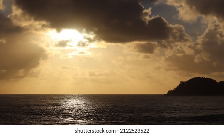 Beautiful Sunrise Over North Haven With Golden Haze And Waves Crashing.