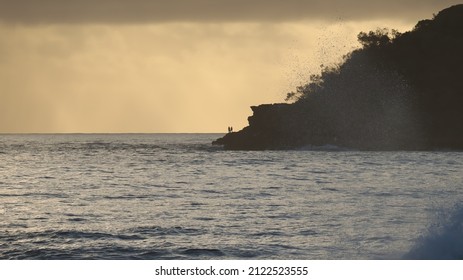 Beautiful Sunrise Over North Haven With Golden Haze And Waves Crashing.