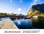 A beautiful sunrise over the picturesque village of Reine in Lofoten Islands, Norway.