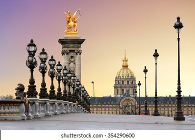 Beautiful sunrise at the Pont Alexandre III and Les Invalides in Paris