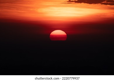 Beautiful Sunrise And Sunset At Horizon Against Orange Sky With Clouds With No People And Serene Darkness Around