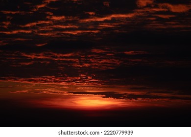 Beautiful Sunrise And Sunset At Horizon Against Orange Sky With Clouds With No People And Serene Darkness Around