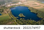 Beautiful Sunrise Sunset over Bela Crkva Lake, Serbia. Aerial view of lake. Aerial Drone view of colorful top of the agricultural fields and a lake at summer.