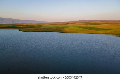 Beautiful Sunrise Time Lapse Sky And Clouds, Panoramic View On The Lake And Mountains.