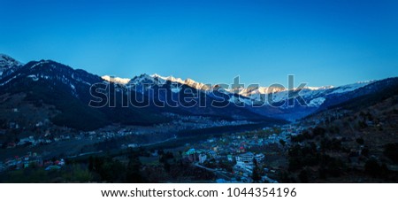 Beautiful sunrise view of Manali and its surroundings snow covered hills in HImachal ,India