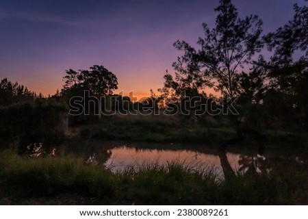 Beautiful Sunset above Peterson Creek River, Yungaburra, Queensland, Australia.