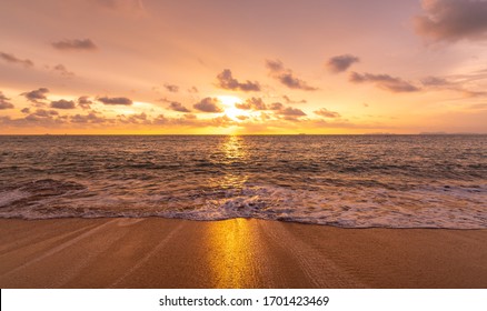 Beautiful sunset above sea or ocean. Vibrant and soft colors, magic light. Small clouds on the sky, reflection of sun in the water and sand on beach. Concept of romantic time on vacation in tropical. - Shutterstock ID 1701423469