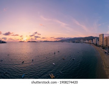 Beautiful sunset, aerial view of the beach, acapulco city seen from above. Travel and vacation concept. Colorful sunset on the beach.