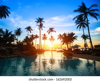 Beautiful Sunset At A Beach Resort In Tropics.