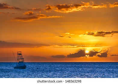 Beautiful Sunset Behind Sport Fishing Boat With A Flying Bridge On Maui, Hawaii, USA