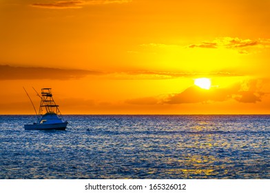 Beautiful Sunset Behind Sport Fishing Boat With A Flying Bridge On Maui, Hawaii, USA