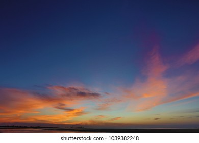 Beautiful Sunset Blue, Orange, Yellow Sky Of Gove Aluminium Refinery Taking From Crocodile Beach Northern Territory, Queensland, Australia 