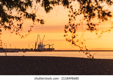 Beautiful Sunset At Caldera Beach In Costa Rica With A Boat In The Water