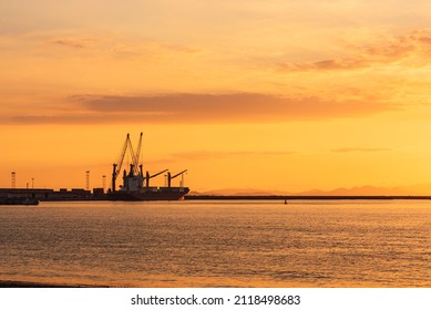 Beautiful Sunset At Caldera Beach In Costa Rica With A Boat In The Water