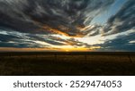 Beautiful sunset cloudy sky from aerial view .Beautiful sky background - Sunset Sunrise sky with light clouds and real sun
