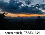 Beautiful sunset with dramatic clouds over the city  