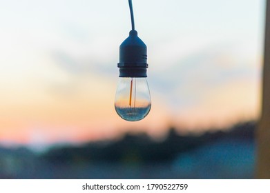 Beautiful Sunset With An Edison Bulb.