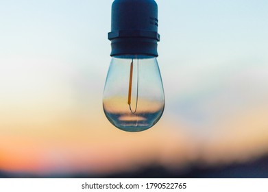 Beautiful Sunset With An Edison Bulb.