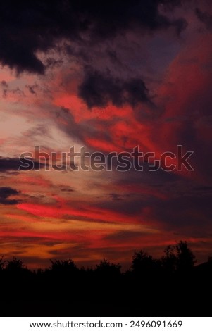 A beautiful sunset featuring numerous clouds beautifully spread across the sky