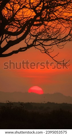 beautiful sunset, hiding behind the hill