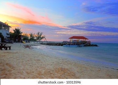A beautiful sunset at a jamaican resort beach