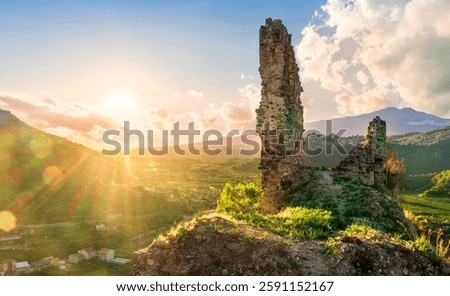 beautiful sunset landscape of ancient Sicilian caslte ruins on the top of a mountain in Italy, Sicily.  Wonderful view of ancient monument with nice evening sky on background