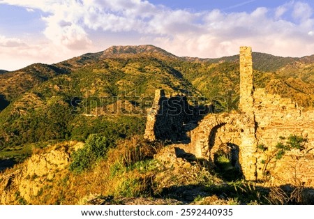 beautiful sunset landscape of ancient Sicilian caslte ruins on the top of a mountain in Italy, Sicily.  Wonderful view of ancient monument with nice evening sky on background