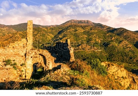 beautiful sunset landscape of ancient Sicilian caslte ruins on the top of a mountain in Italy, Sicily.  Wonderful view of ancient monument with nice evening sky on background