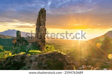 beautiful sunset landscape of ancient Sicilian caslte ruins on the top of a mountain in Italy, Sicily.  Wonderful view of ancient monument with nice evening sky on background