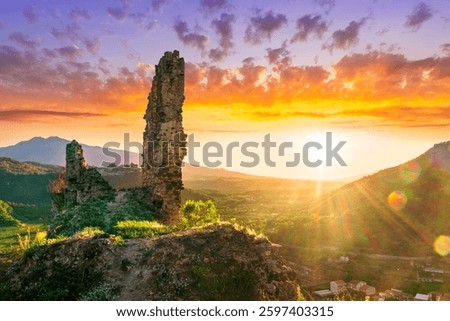 beautiful sunset landscape of ancient Sicilian caslte ruins on the top of a mountain in Italy, Sicily.  Wonderful view of ancient monument with nice evening sky on background