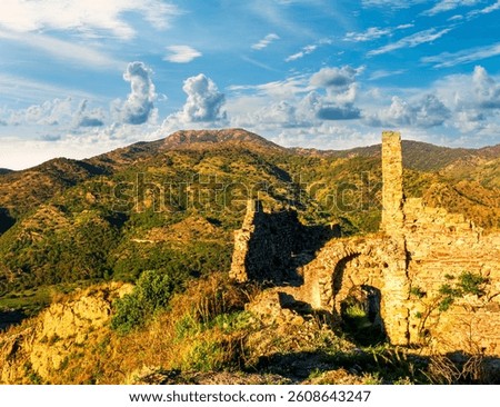 beautiful sunset landscape of ancient Sicilian caslte ruins on the top of a mountain in Italy, Sicily.  Wonderful view of ancient monument with nice evening sky on background