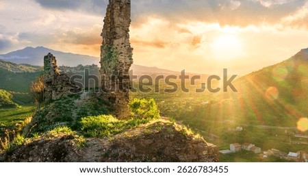 beautiful sunset landscape of ancient Sicilian caslte ruins on the top of a mountain in Italy, Sicily.  Wonderful view of ancient monument with nice evening sky on background