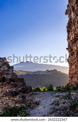beautiful sunset landscape of ancient Sicilian caslte ruins on the top of a mountain in Italy, Sicily.  Wonderful view of ancient monument with nice evening sky on background