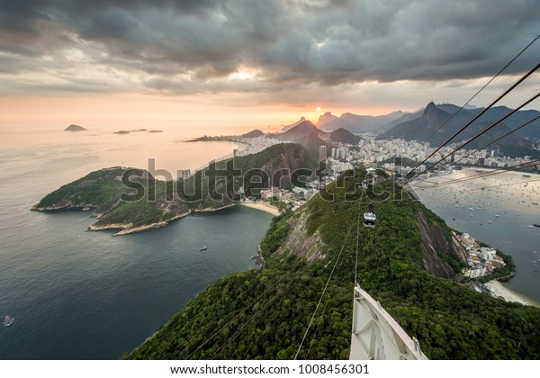 Beautiful sunset landscape from Pao de\
Acucar (Sugar Loaf Mountain) in Rio de Janeiro,\
Brazil