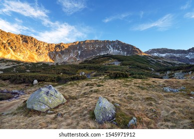 Beautiful sunset in the mountains. Valley of five Ponds. Tatra National Park in Poland.